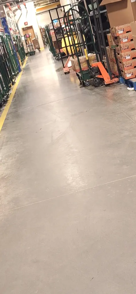 Warehouse aisle concrete scrubbed and polished on an overnight shift