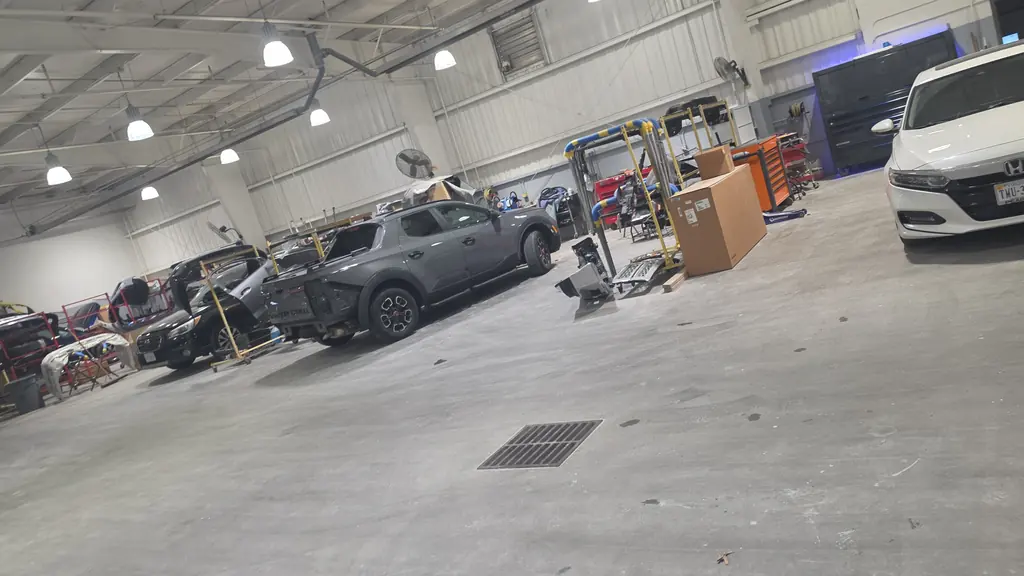 New car dealership service bay cleaned before opening