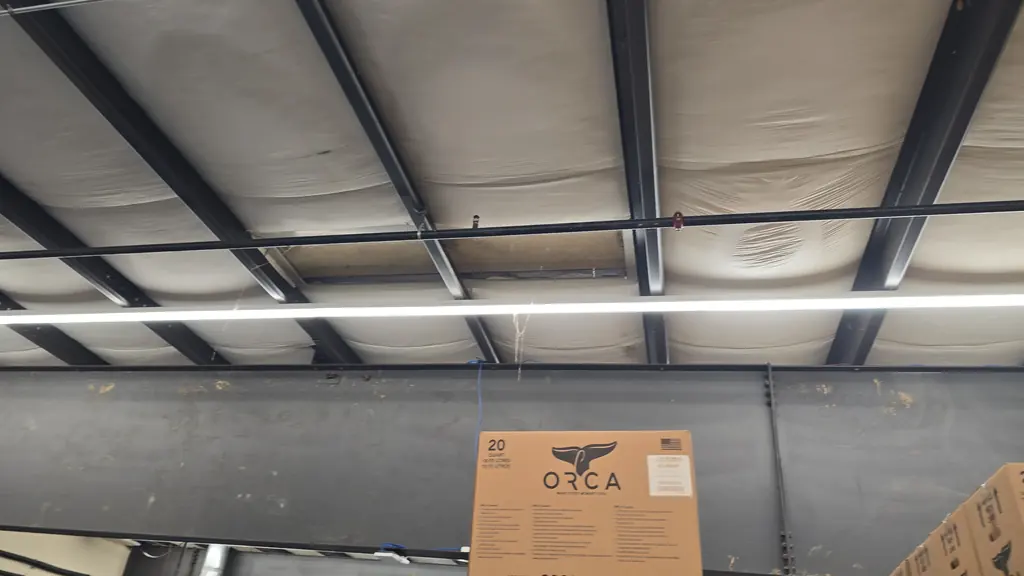 High bay ceiling and structural steel cleaned after construction