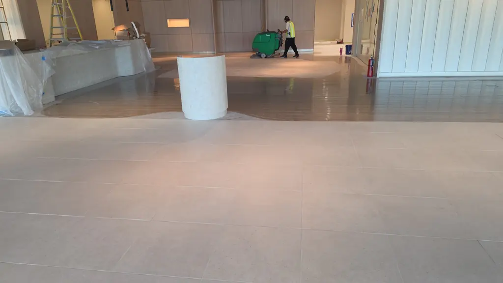 Final cleaning pass on a new commercial lobby floor