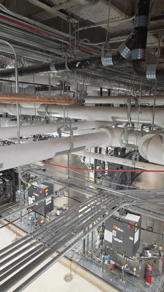 Mechanical room piping cleaned before building handover