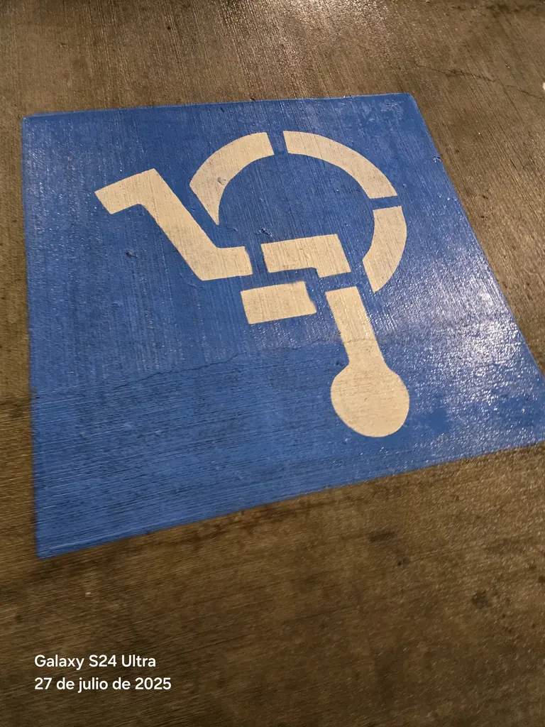 Accessible parking symbol brought back by pressure washing